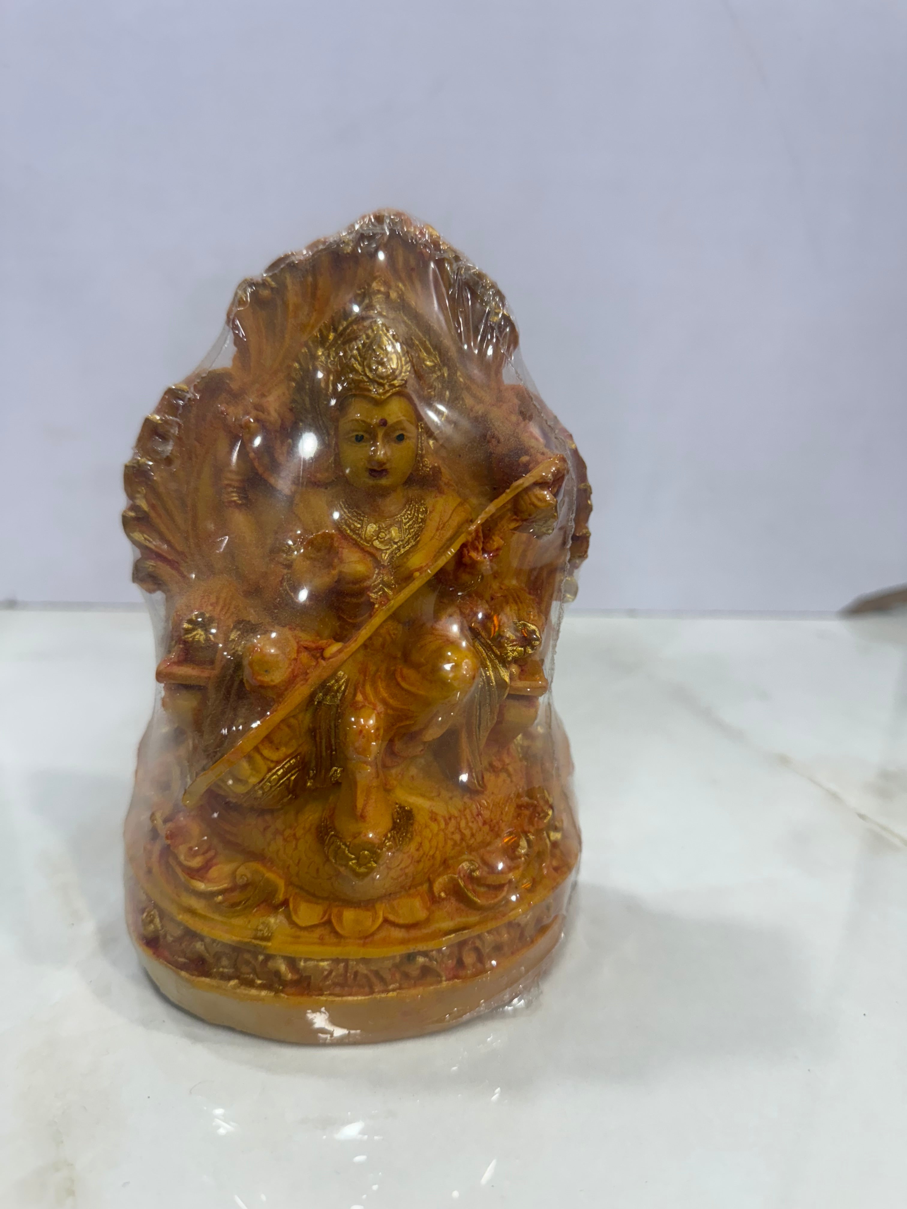 Decorative lion head sculpture on a white background